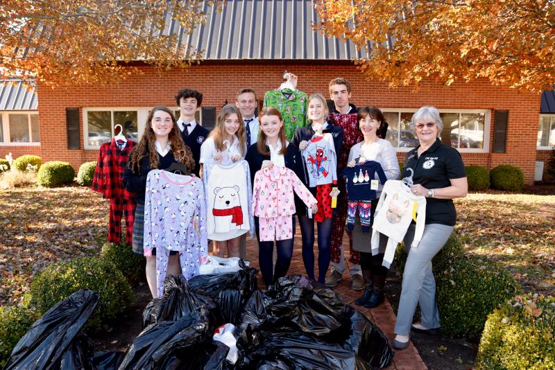 Upper School students shown are in back (l-r) Hayes Peterson, Alex Bunting, and Gavin Henschel. In front are students Brooke Phillips, Anna Williams, Quinn McColgan, and Maddy Shanahan with WPS English teacher/NHS advisor Kathleen Otway and United Way of the Lower Eastern Shore Leadership & Planned Giving Officer Cathie Thomas, a Pajama Program volunteer. SUBMITTED PHOTOS